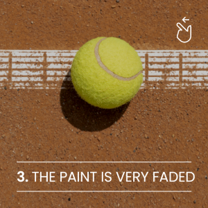 Faded paint on tennis court - signs of tennis court needs to be resurfaced