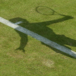 shadow of tennis player on a tennis court at wimbledon