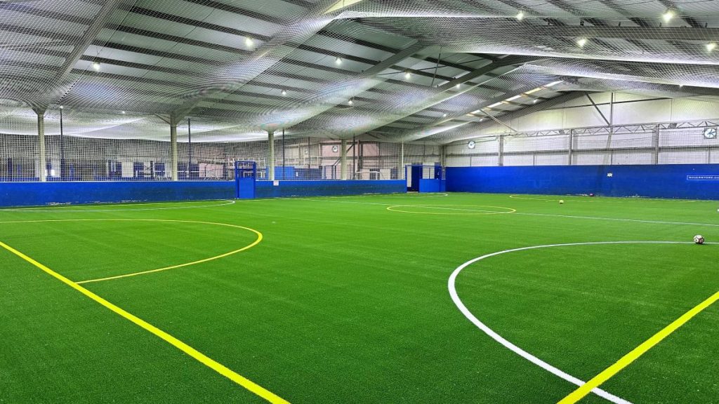 Blackburn Rovers football club resurfacing football pitch
