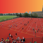 red and orange background with a church sports surface in the foreground